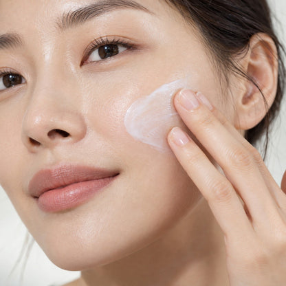 Repair Set + Cleanser step 03: applying Repair Protector on the cheek